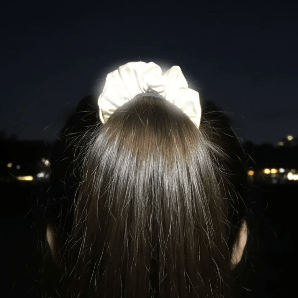 Silver Reflective Hair Srunchie on a poneytail nightime fully reflective backview by Proviz